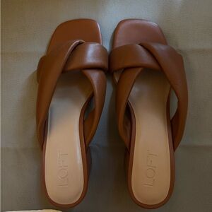 LOFT cross sandals in brown.